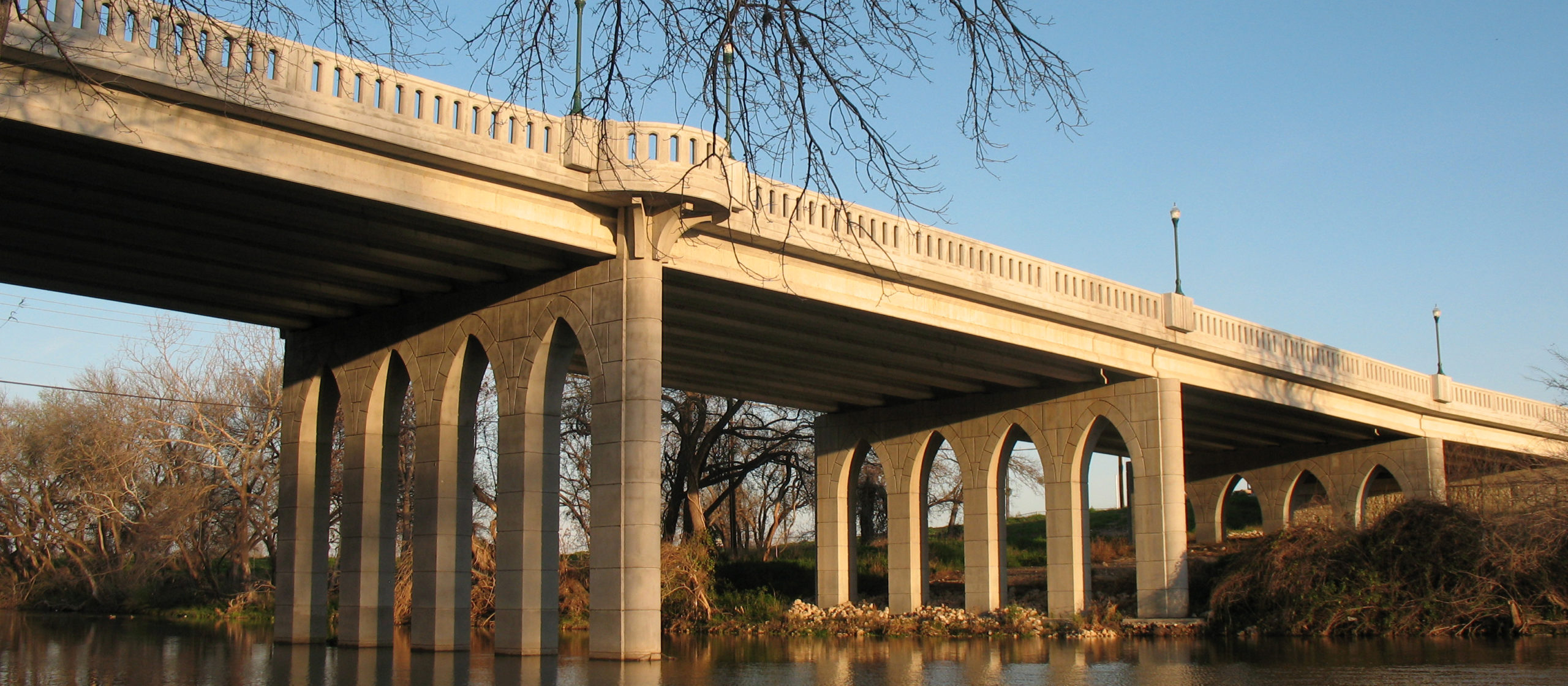 view of bridge from river banks