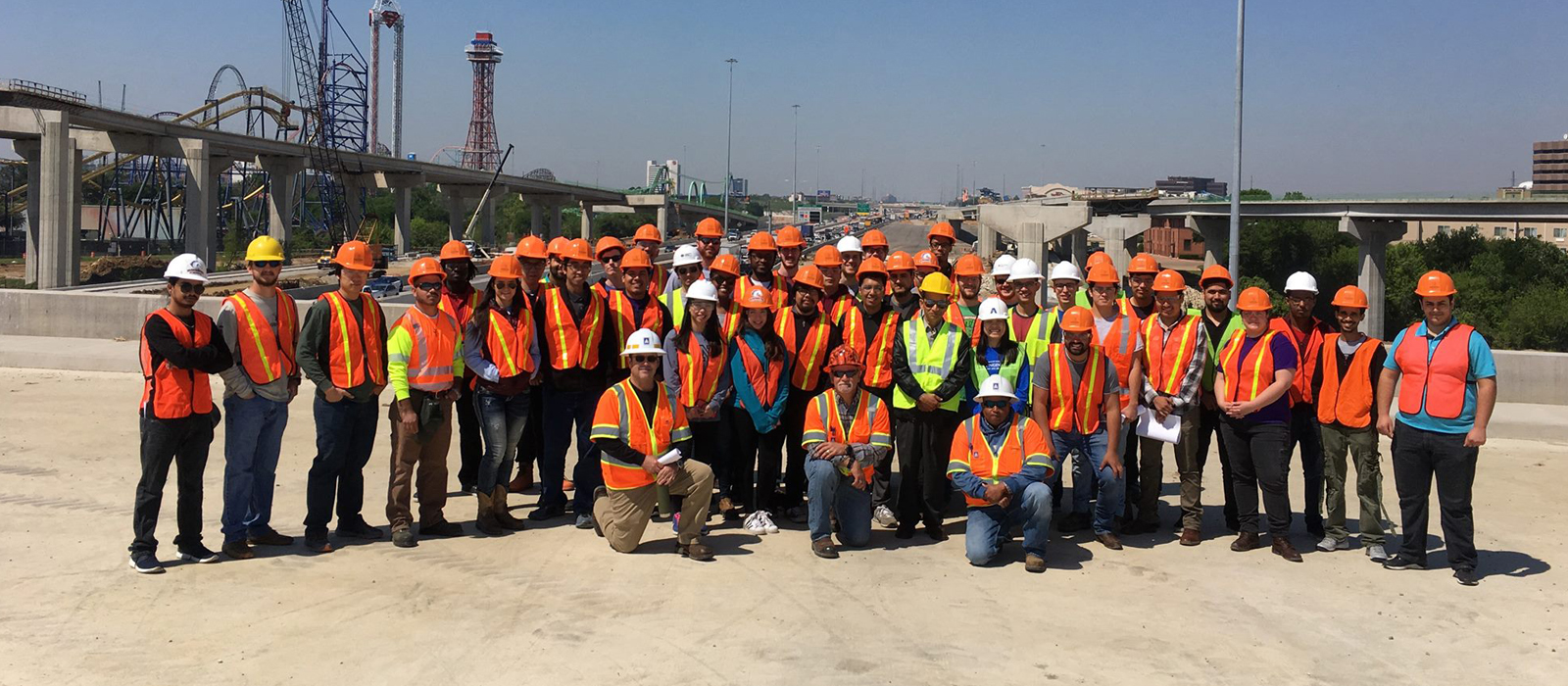 Group photo of students at construction site