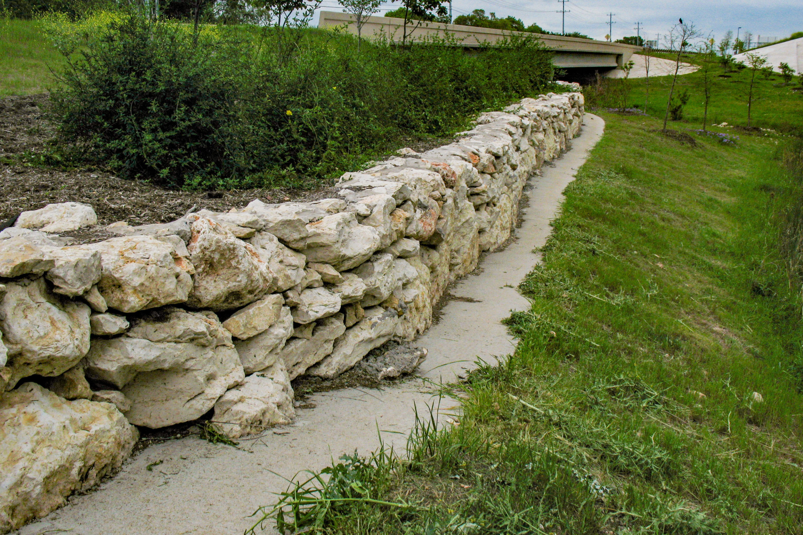 Retaining rock wall at US 183A