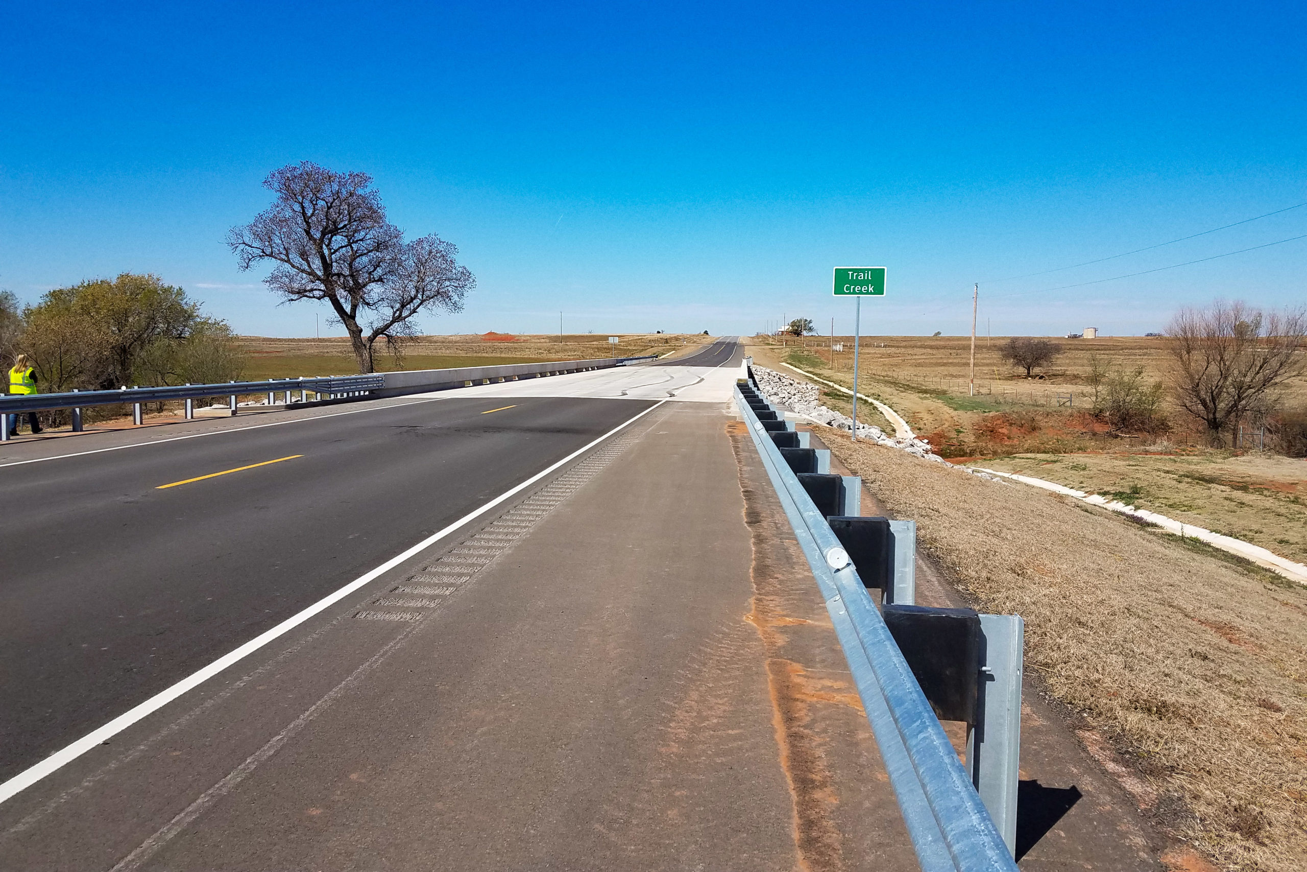 SH 152 road with striping over Trail Creek