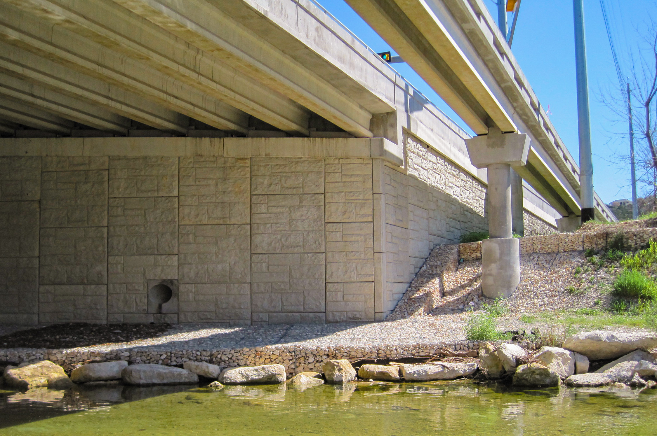 View of Utility Bridge Over Bull Creek from river bank