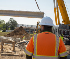 Aguirre & Fields engineers reviews project at job site