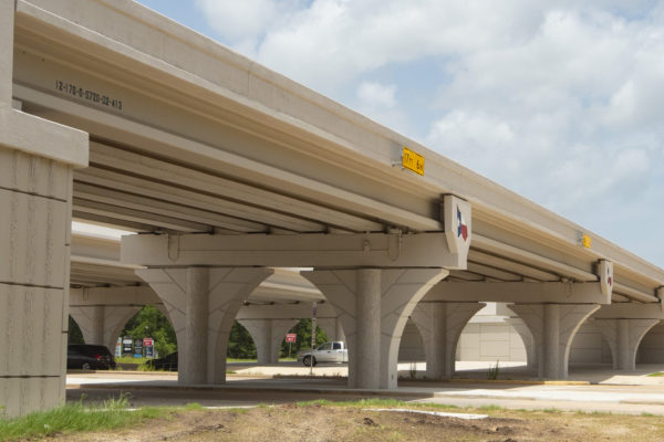 View from ground of SH 249 Tomball Tollway bridge columns