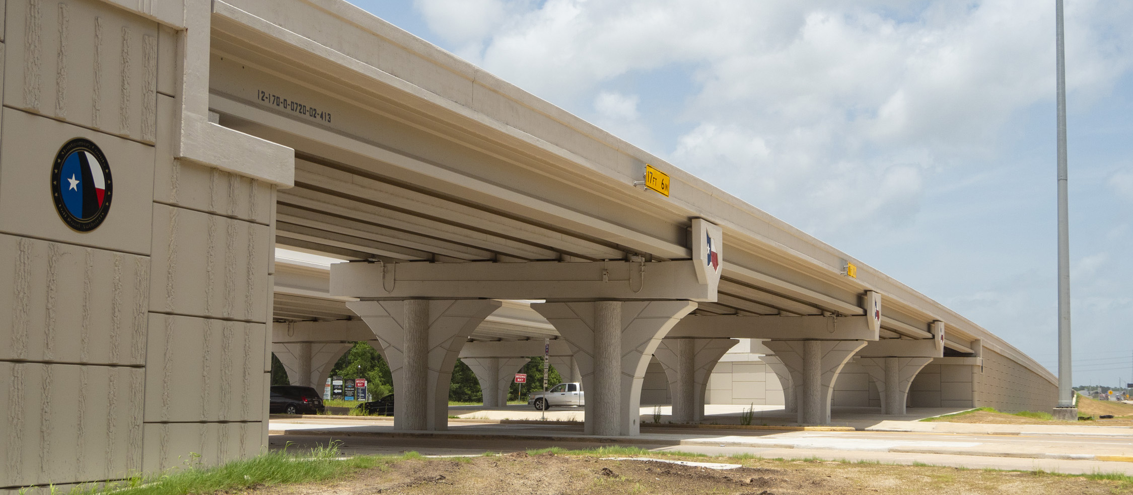 View from ground of SH 249 Tomball Tollway bridge columns