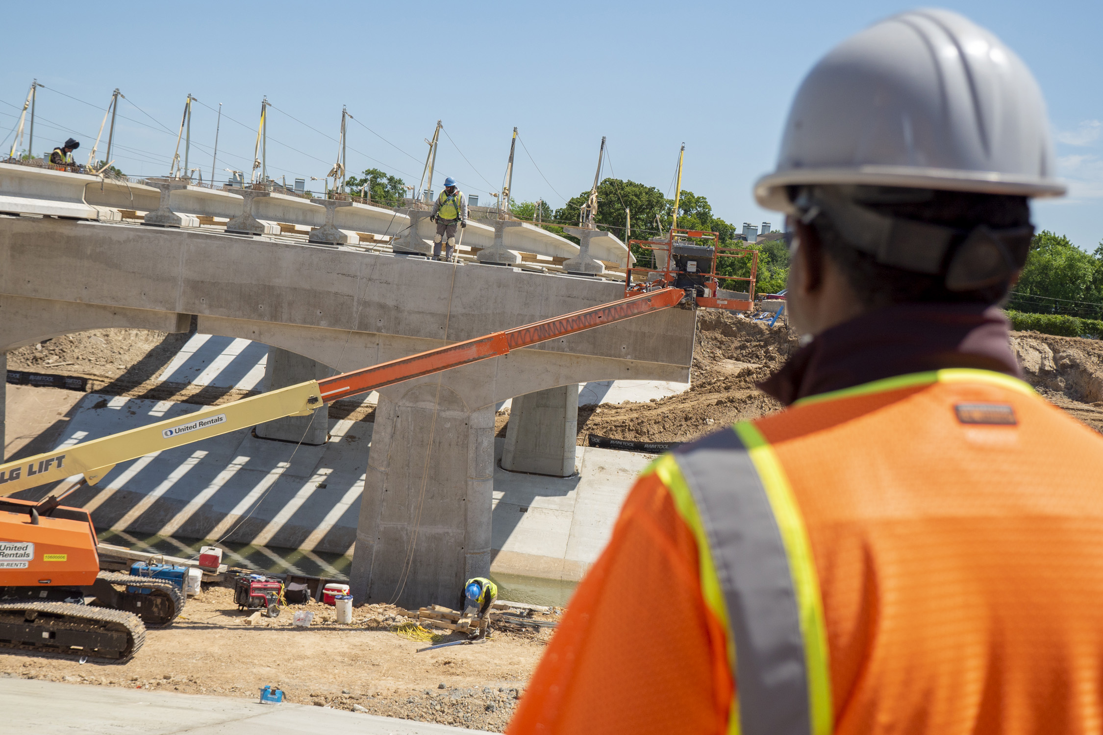 Worker overseeing bridge project