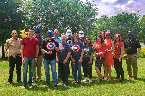 Aguirre & Fields employees dressed as Superheroes