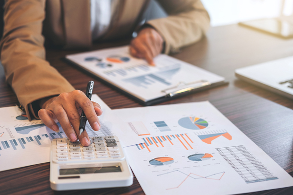 Man reviewing finances at desk