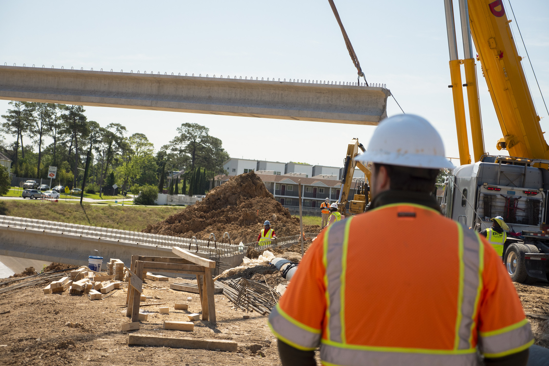 Worker overseeing bridge project