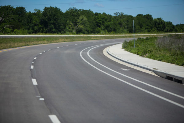 View of curve on road with striping